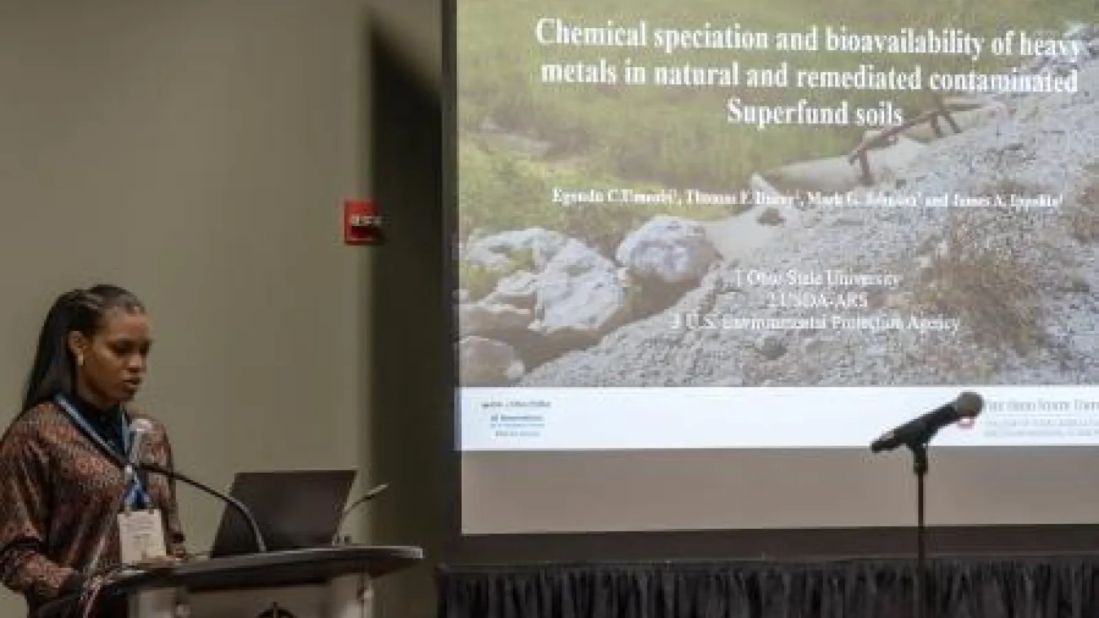 Egondu Umeobi presenting a research talk at a conference.